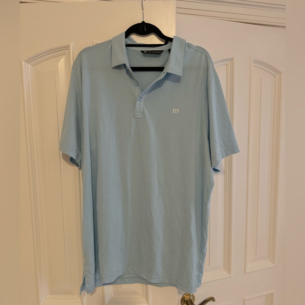 Travis Mathew blue shirt